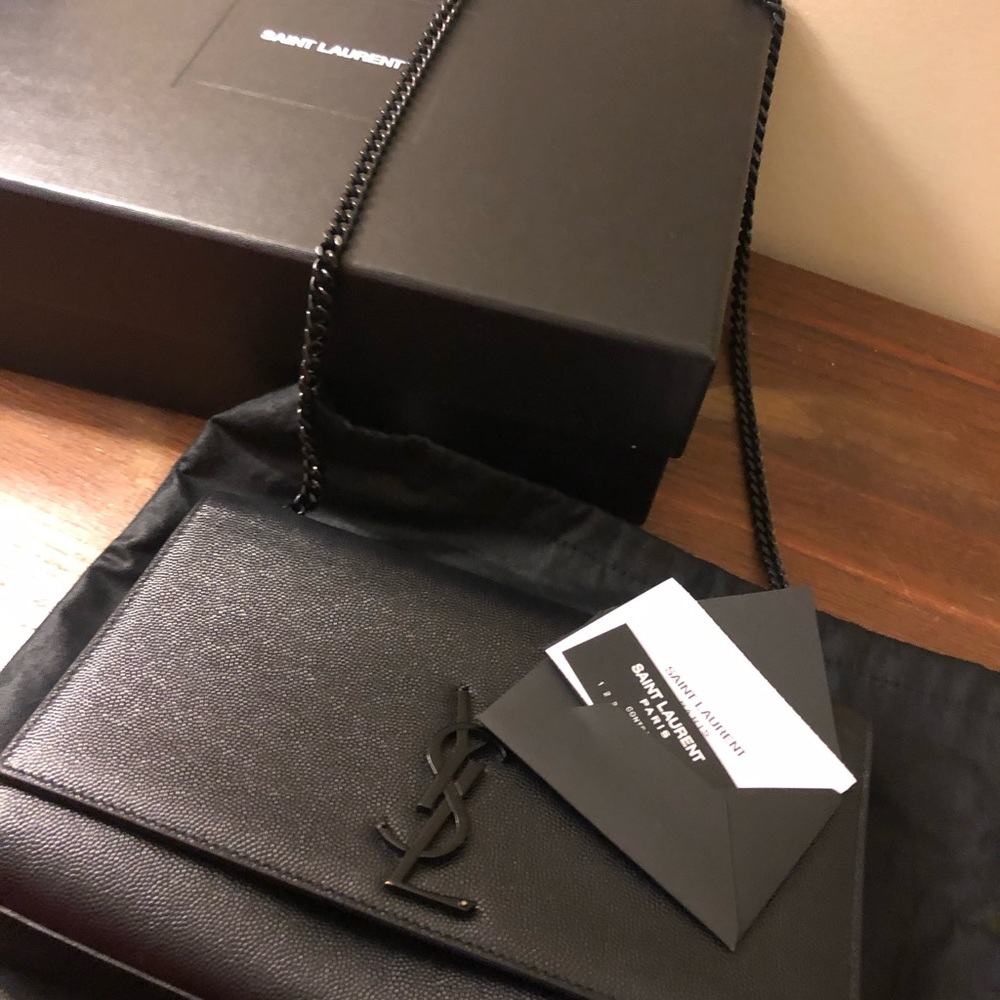 YSL clutch handbag.